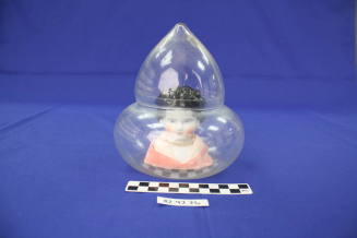 Doll Head In Glass Case