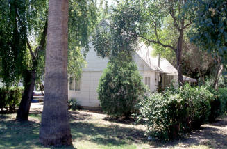 Side and back yard of residence, 1110 S. Farmer Ave.