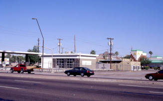 Closed service station, 904-916 E. Apache Blvd.