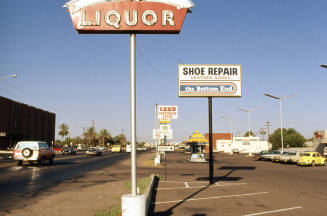 Liquor, Shoe Repair, and other signs
