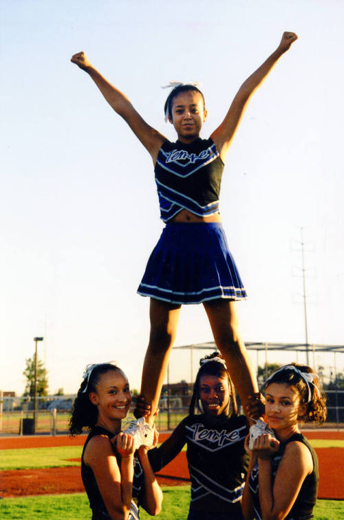 Tempe High School - Four Cheerleaders, Holding One Up High