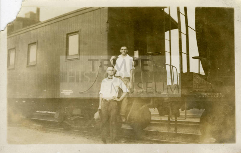 Joe Rogers and Ralph Basset in Front of a Train.