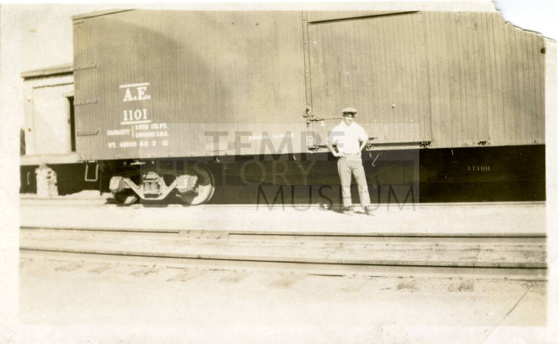 Joe Rogers Standing in Front of a Train