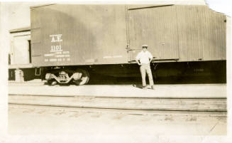 Joe Rogers Standing in Front of a Train