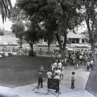 Adults and Children Standing Near a Vote Here Sign, Tempe City Hall