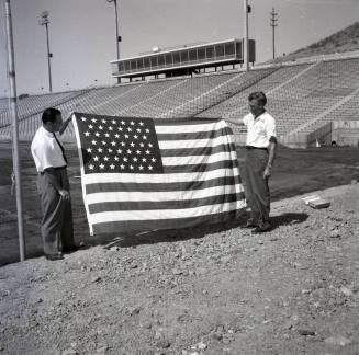 Two Men with an American Flag at Sun Devil Stadium
