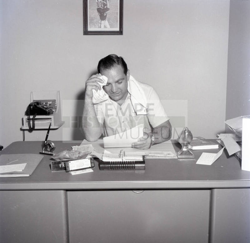 Frank Kush Seated at His Desk