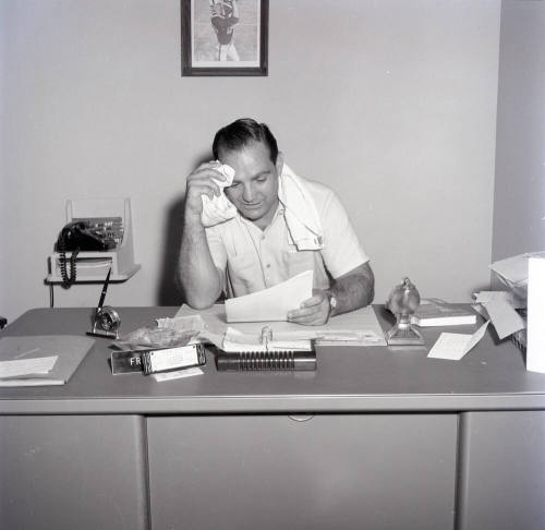 Frank Kush Seated at His Desk