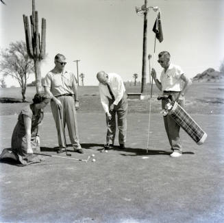 Golfers at Papa-Go Golf Course