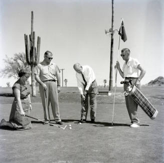 Golfers at Papa-Go Golf Course