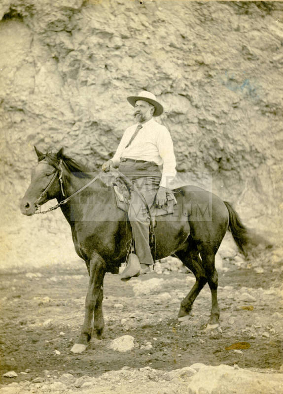 Dr. Fenn J Hart on horseback in a mountain canyon