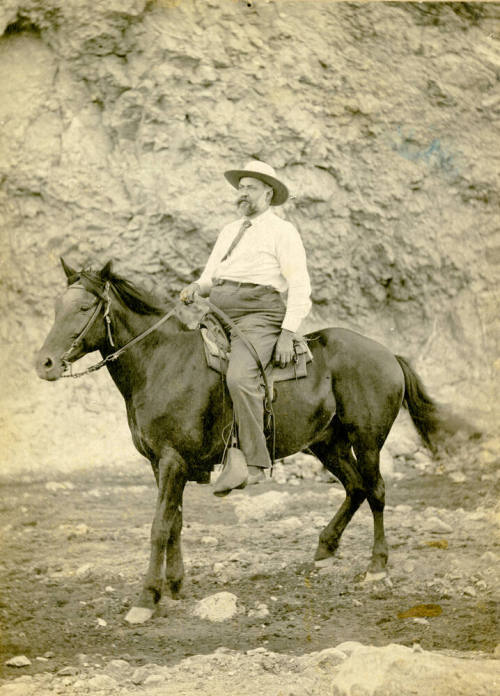 Dr. Fenn J Hart on horseback in a mountain canyon