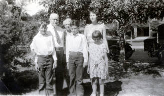Group photo of Dr. Fenn J Hart with his wife Rosa Brown Hart, daughter Mildred Hart Wilson and three grandchildren