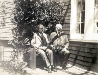 Thomas Knight and Dr. Fenn J Hart sitting on a bench outside Mr. Knight's home in San Francisco