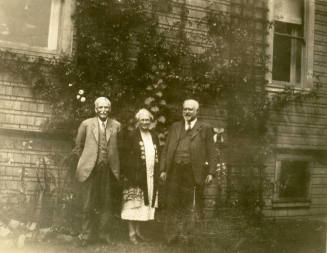 Group photo of Thomas Knight, Rosa Brown Hart and Dr. Fenn J Hart standing outside Mr. Knight's home in San Francisco.