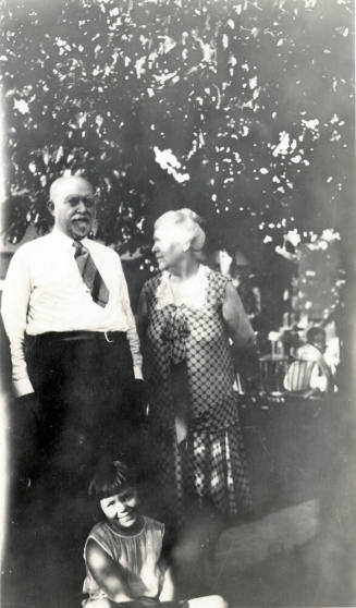 Group photo of Dr. Fenn J Hart standing outside with an unkown elderly woman and an unkown school-age girl