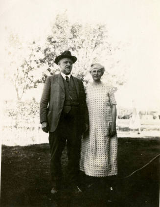 Dr. Fenn J Hart and wife Rosa Brown Hart posing outdoors together at an unkown location