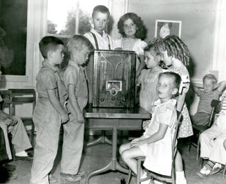 Children Listening to a Radio