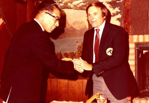 Shojiro Ozu and Harry Mitchell shaking hands at Monti's