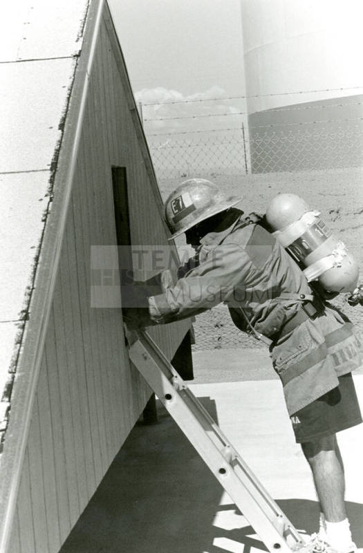 Tempe Fire Department Fireman using Ladder