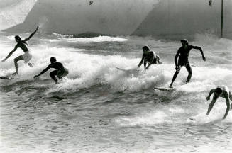 Surfers "Hang Ten" at Tempe's Big Surf