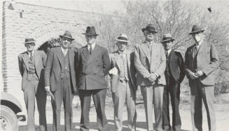 Photo- group of seven men dressed in suits and hats