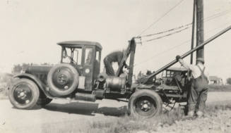 Photo- line truck and men working on power lines