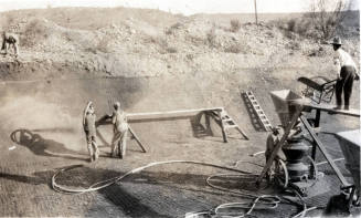 Photo- men working on canal lining