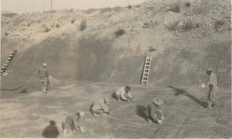 Photo- men working on canal lining