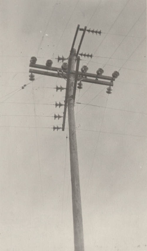 Photo- power pole with crossbars and insulators