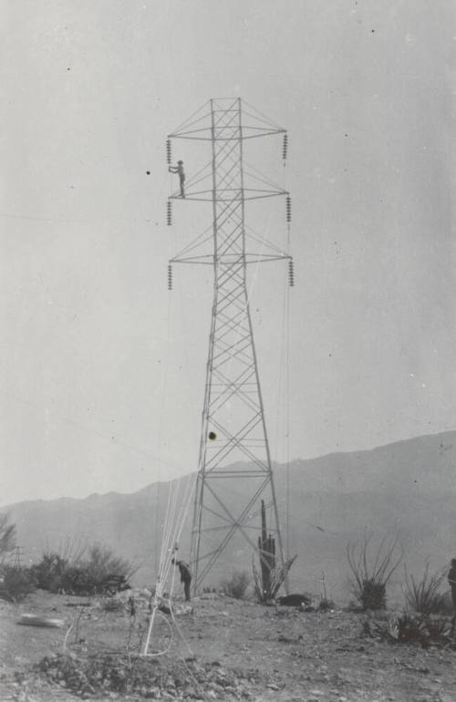Photo- Construction crew installing a line tower on Horse Mesa