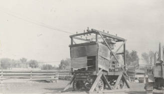 Photo- View of a early mobile electricial generator and tractor