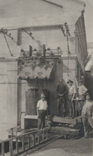 Photo- View of several workers standing near Arizona Falls Power  Plant