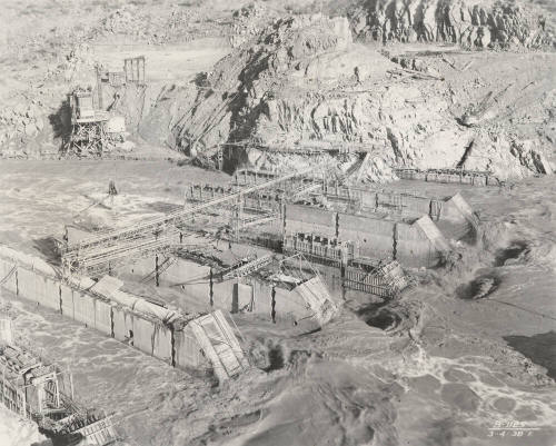 Photo-View of a flooded Verde River showing partial construction of Bartlett Dam