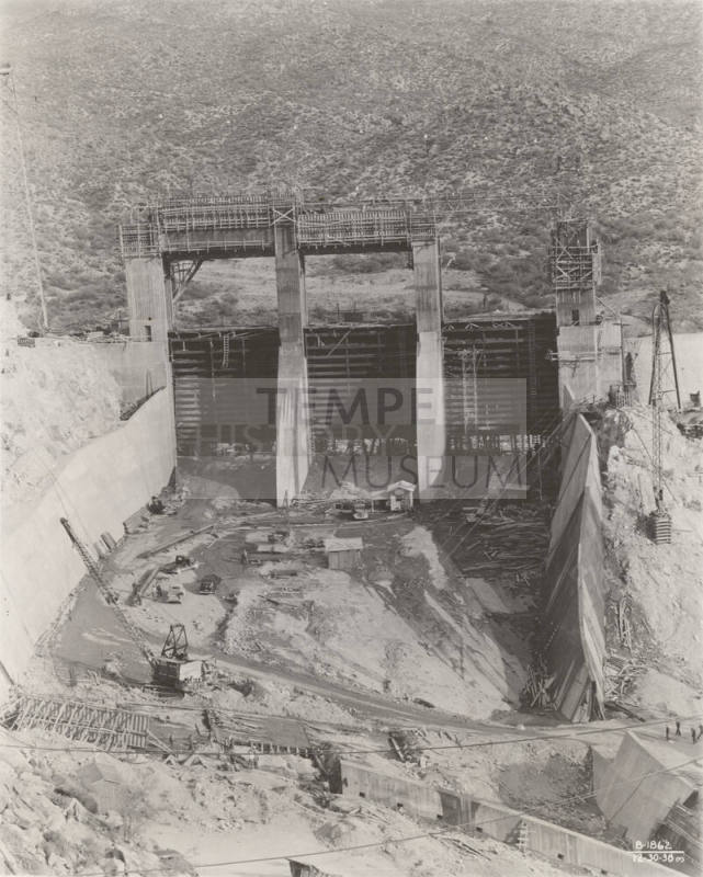 Photo-Frontial view of the construction of Bartlett Dam's three spillway gates