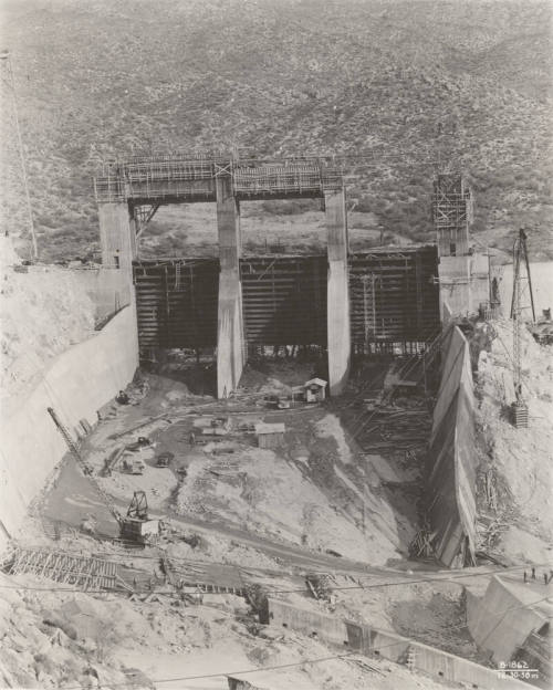 Photo-Frontial view of the construction of Bartlett Dam's three spillway gates