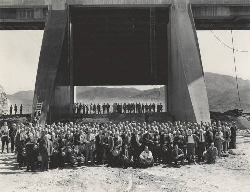 Photo- View of a large group of people in front  of the Bartlett Dam spillway