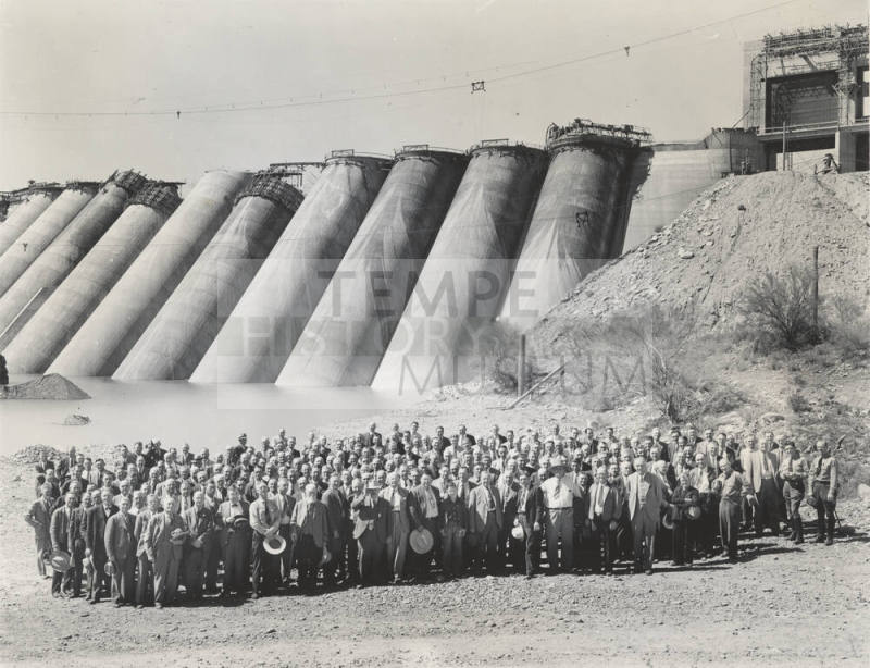 Photo- View of a large group of people in front of the Bartlett Dam