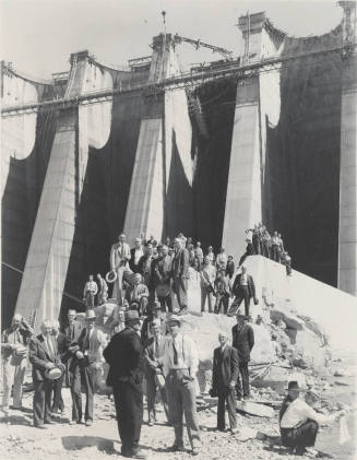 Photo- View of a large group of people standing at the base of Bartlett Dam