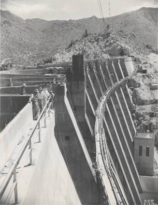 Photo- View of five workers standing on top of Bartlett Dam