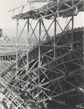 Photo- View of arched forms and scaffolding for construction of Bartlett Dam