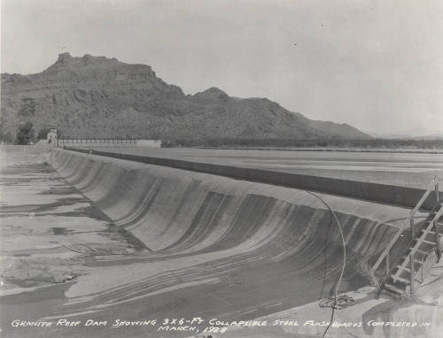 Photo-View of water flowing over steel flashboards at Granite Reef Diversion Dam
