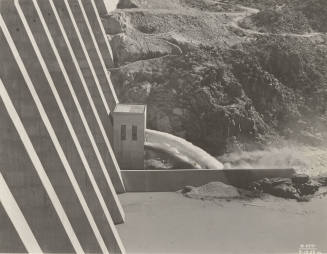 Photo- View of water running through needle valve outlet at Bartlett Dam