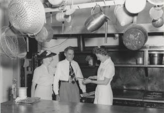 Mr. & Mrs. Krause and Cook in Dining Hall kitchen