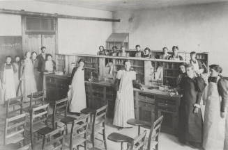 Chemistry laboratory in Old Main Building with Frederick M. Irish, Science teacher