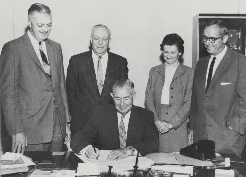 Governor Ernest Mcfarland and others sign canvas of votes on December 5, 1958