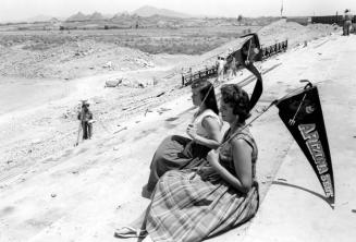 Two Women Watch the Construction of Sun Devil Football Stadium