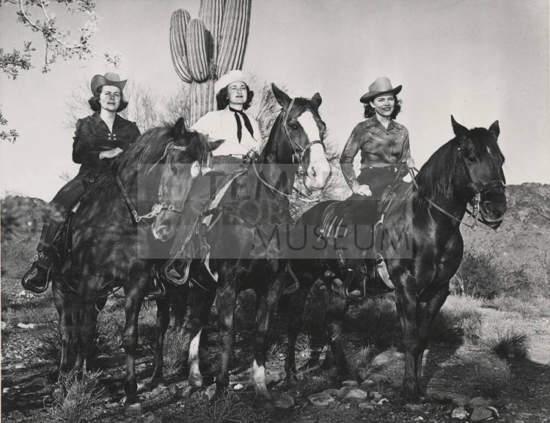 Lady Riders in Front of Cactus in the Desert