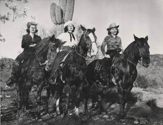 Lady Riders in Front of Cactus in the Desert