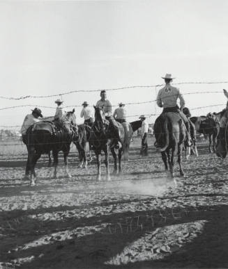 Rodeo Contestants Preparing for a Ride